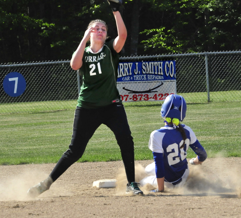 Madison’s Tori McLaughlin slides safely into second base as Carrabec’s Mickayla Willette fields a throw during a Mountain Valley Conference game Tuesday afternoon. Madison prevailed 6-1.