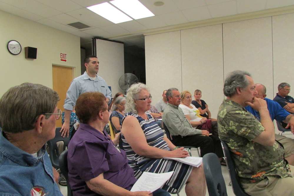 Fairfield Town Manager Josh Reny addresses the SAD 49 school board at an informational session Tuesday evening at Lawrence Junior High School. The board is considering cuts to a $25.9 million budget that was rejected by voters in a referendum vote May 19.