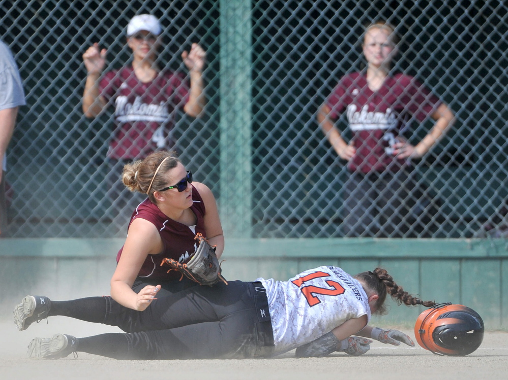 Nokomis third baseman Austin Leighton, left, collides with Winslow Haley Pottle in the first inning of a Kennebec Valley Athletic Conference Class B game Wednesday in Winslow. The Warriors won 4-1 in eight innings.