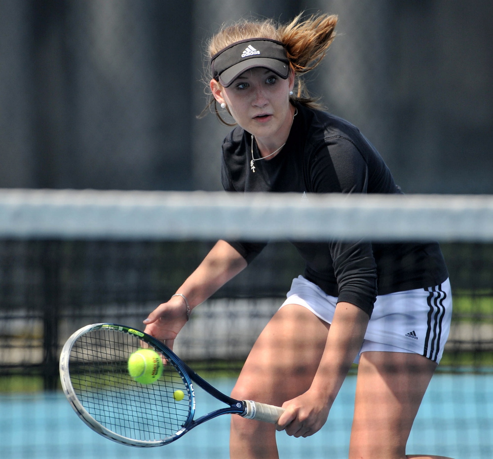 St. Dominic High School’s Bethany Hammond competes against Cheverus High School’s Natalia Mabor.