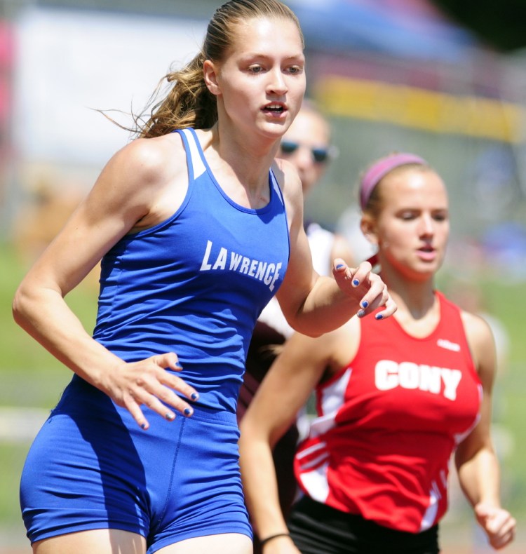 Lawrence’s Abby Weigang, left, leads Cony’s Madeline Reny in the 300-meter hurdles during the Kennebec Valley Athletic Conference track and field championship last Saturday in Bath. Weigang will look to win a state title Saturday at Mt. Ararat.