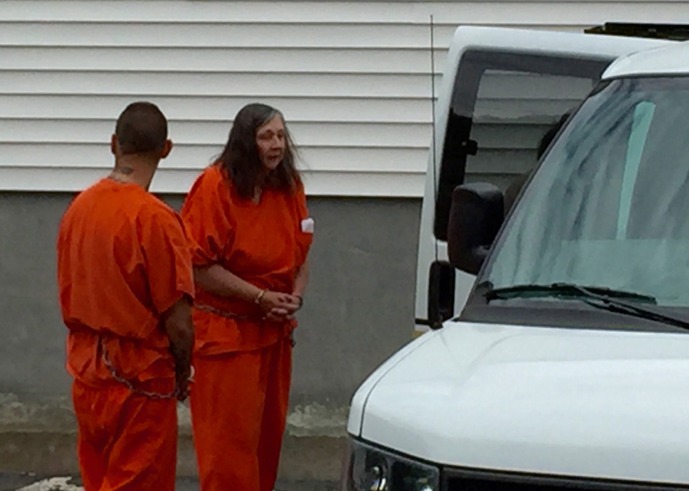 Carol Murphy is led from Franklin County Superior Court Friday after a failure-to-appear hearing. Murphy was found in contempt of court in October for having pets after she had been banned in 2005 and 2010 from owning animals.