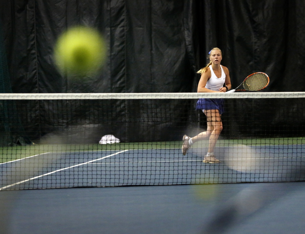 Olivia Leavitt of Falmouth returns a shot Monday on her way to another championship.
