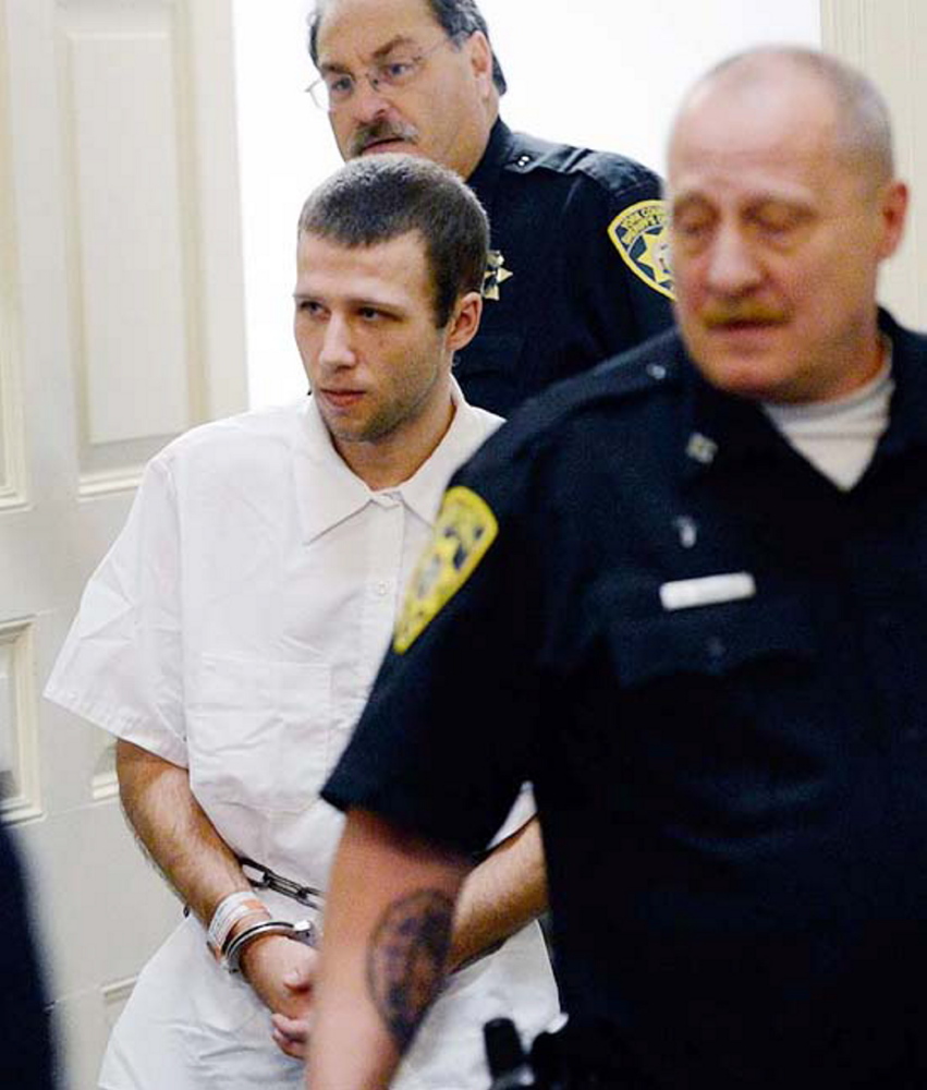 Derek Poulin, who is charged with arson and murdering his grandmother, Patricia Noel, is led into York County Superior Court in Alfred on Oct. 30, 2012.