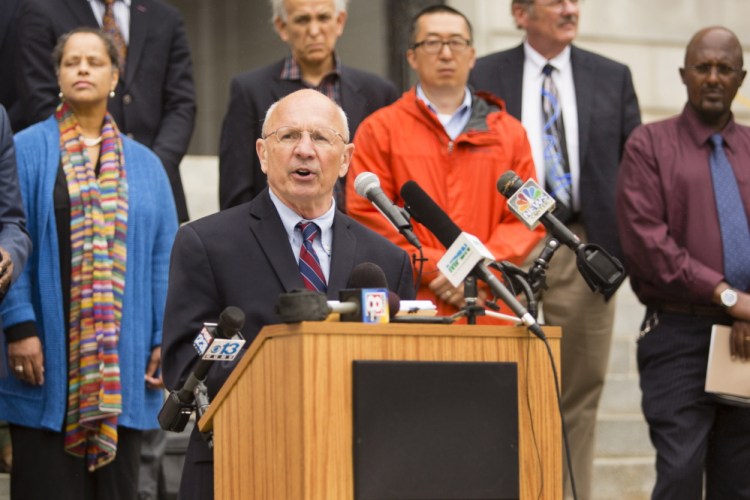 Portland Mayor Michael Brennan speaks in front of City Hall on Monday to advocate for legislation to make asylum seekers eligible for General Assistance. He said more than 900 people in Portland could go homeless next month unless the city decides to continue the aid without state funds.