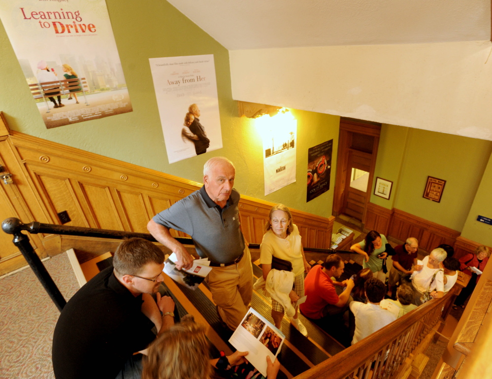 People wait in line Friday night in the Waterville Opera House hallway for the movie “Tumbledown” to kick off the opening night of the Maine International Film Festival in Waterville.