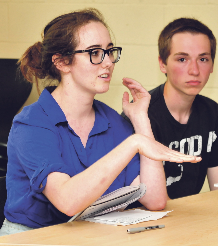 Writing student Grace Drennan discusses her point of view on a topic Tuesday during the Longfellow writing program at the University of Maine in Farmington.