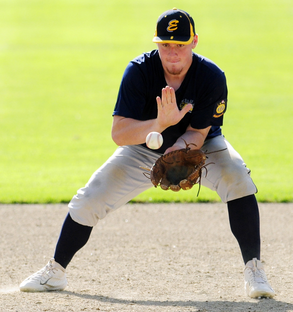 Augusta Elks third baseman Mitchell Caron fields a bouncing ball during a Zone 2 Americal Legion playoff game Thursday at McGuire Field in Augusta.