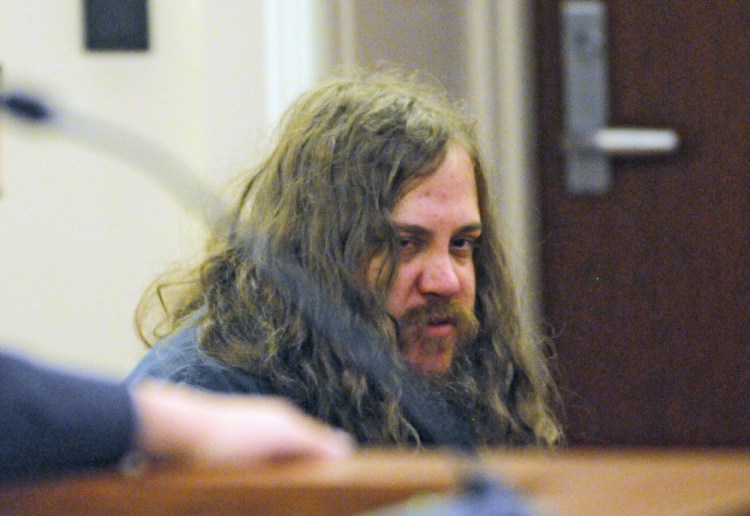 Eric Bard, 25, of Sidney, listens to testimony during a hearing on Friday in the Capital Judicial Center in Augusta.