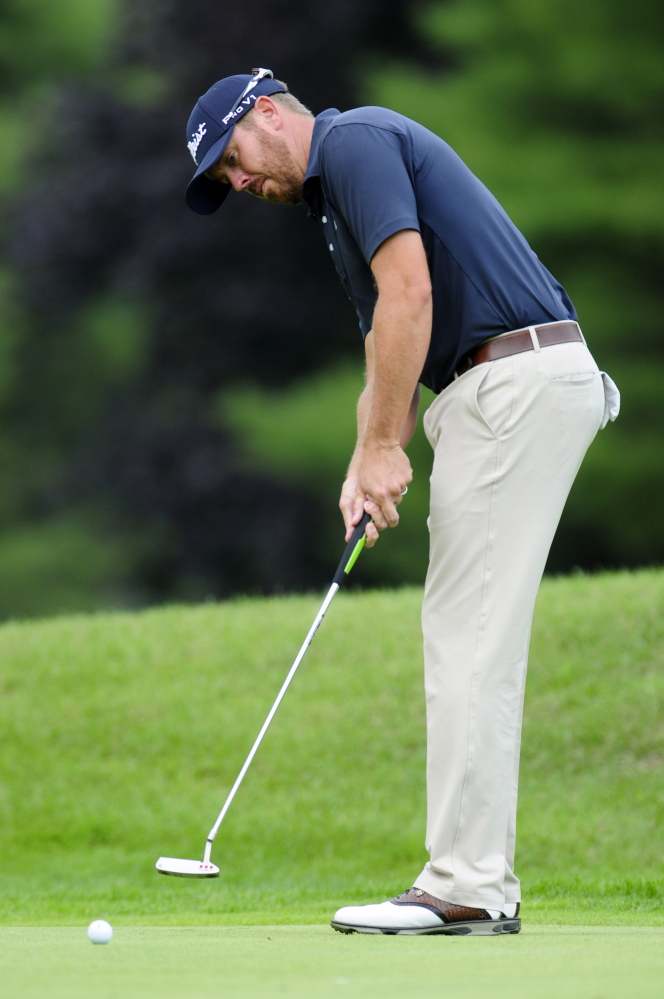 Brian Agee putts on the third green during the second round of play at the Charlie’s Maine Open on Tuesday at the Augusta Country Club in Manchester.