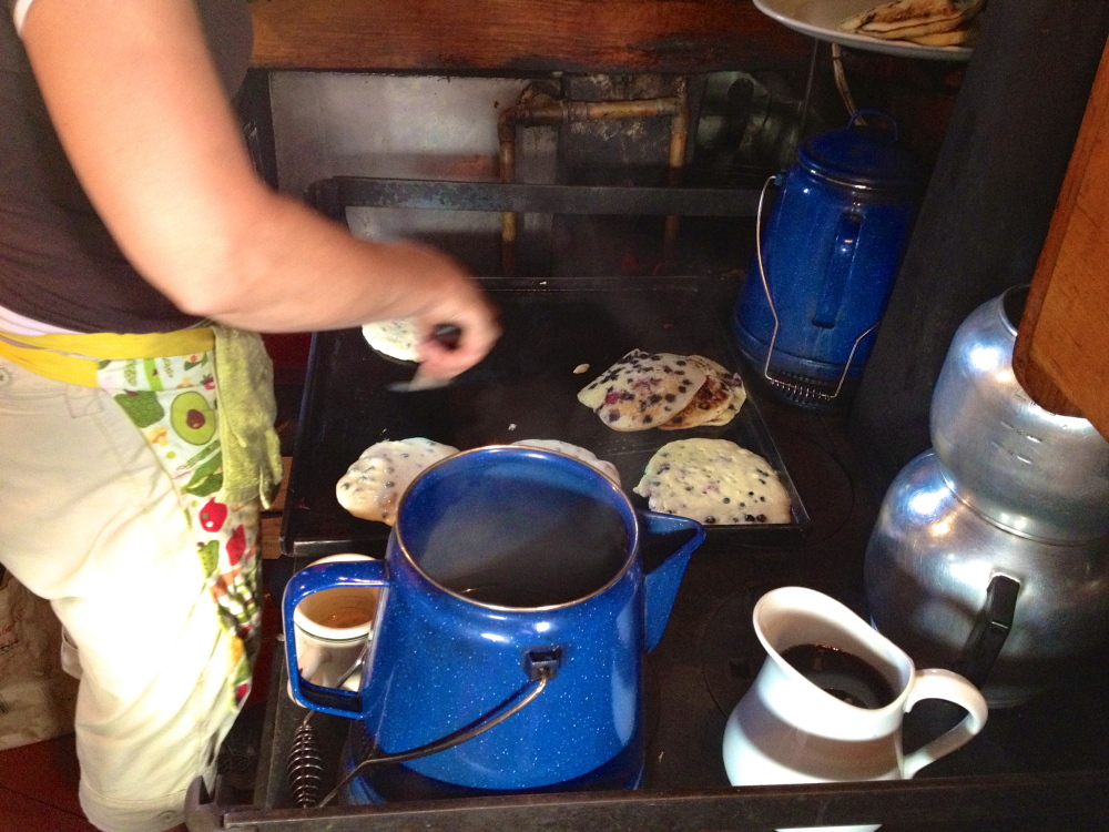 From a griddle in the galley, blueberry pancakes.