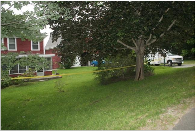 Police tape surrounds a house on Montgomery Road in Boothbay Harbor, where state and local police are investigating a death. 
Courtesy Boothbay Register