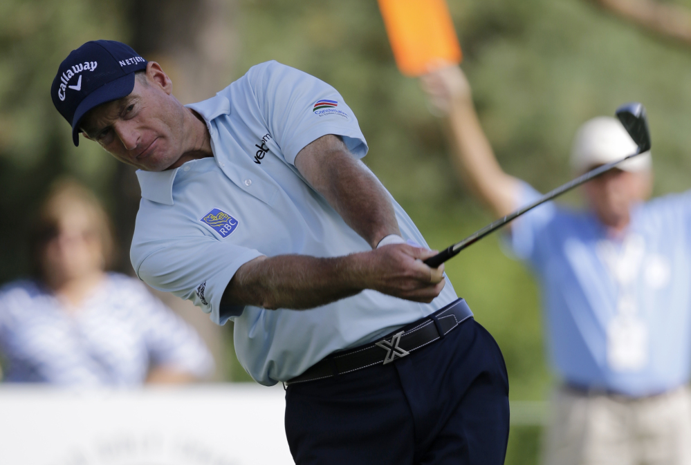 Jim Furyk tees off on the 12th hole during the second round of the Bridgestone Invitational on Friday at Firestone Country Club in Akron, Ohio.