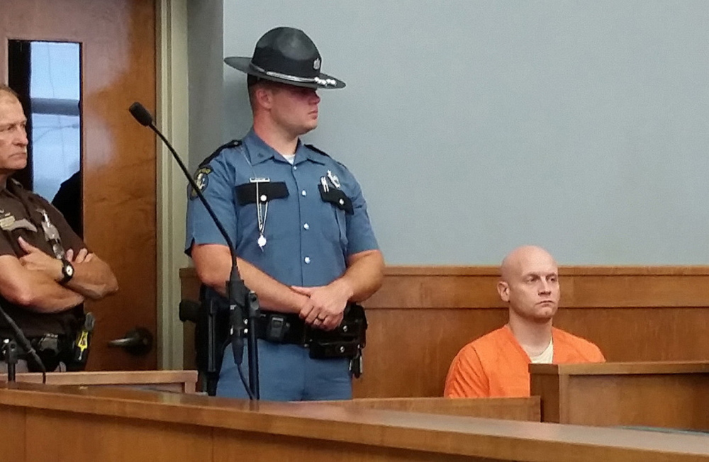 Robert Burton waits on Wednesday at Piscataquis County Superior Court in Dover-Foxcroft to be returned to his jail cell.