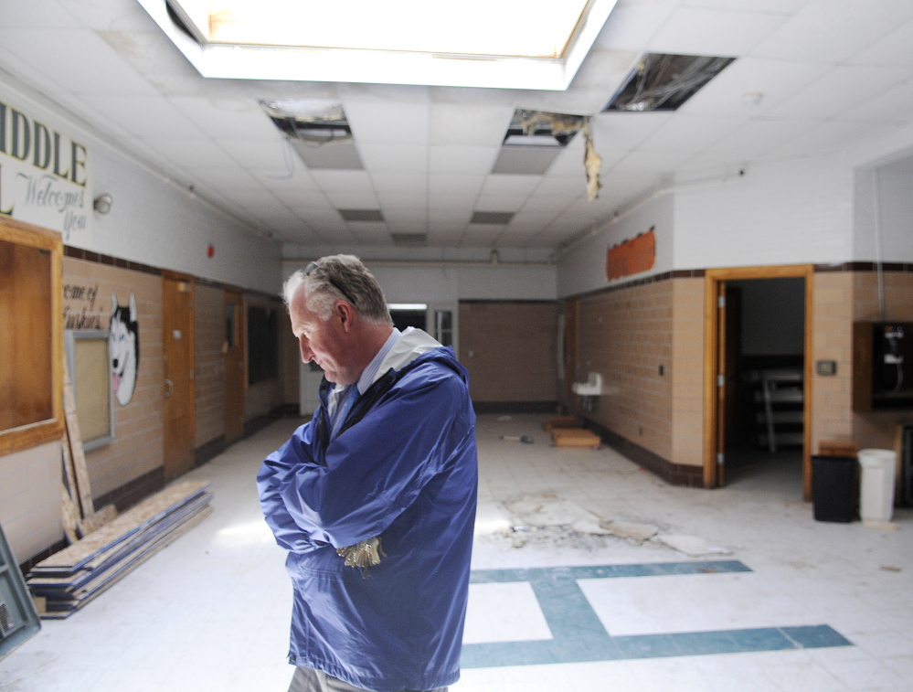 City of Augusta Facilities Manager Bob LaBreck enters the lobby of the former Hodgkins Middle School in Augusta. The Augusta Housing Authority and a local developer plan to redevelop the abandoned building into senior housing.