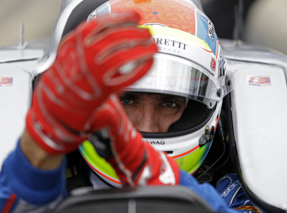 Justin Wilson was in a coma in critical condition after sustaining a head injury when he was hit by a large piece of debris that broke off another car in the crash-filled race at Pocono Raceway on Sunday.