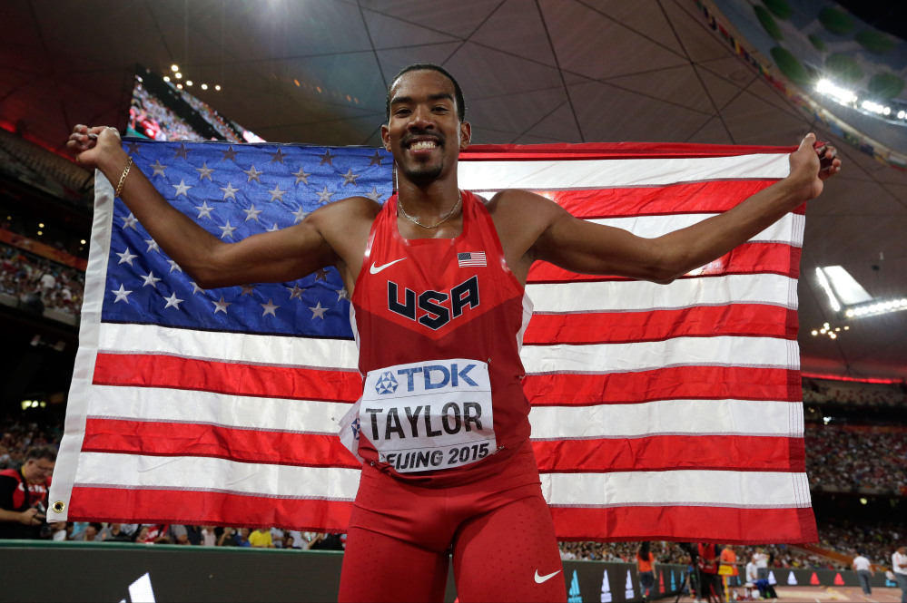 Christian Taylor celebrates after winning the gold medal in the men’s triple jump final at the World Athletics Championships at the Bird’s Nest stadium in Beijing on Thursday.