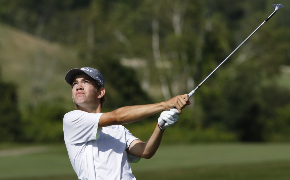 Austin Legge of Cape Elizabeth shoots for the green on the 18th hole Thursday at Toddy Brook Golf Course in North Yarmouth. Legge shot a 75 Thursday to capture the Maine Junior Amateur Championship in the 15-17-year-old division.