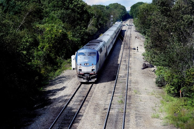 The Downeaster makes its way south Thursday in South Portland. Work is set to start next month on a train shed in Brunswick, even though a neighborhood group's appeal could kill the project. Shawn Patrick Ouellette/Staff Photographer