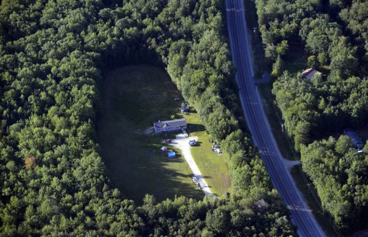 Police from multiple agencies are searching this area off Route 108 in Canton in the cold-case disappearance of Kimberly Moreau, who was last seen in May 1986.