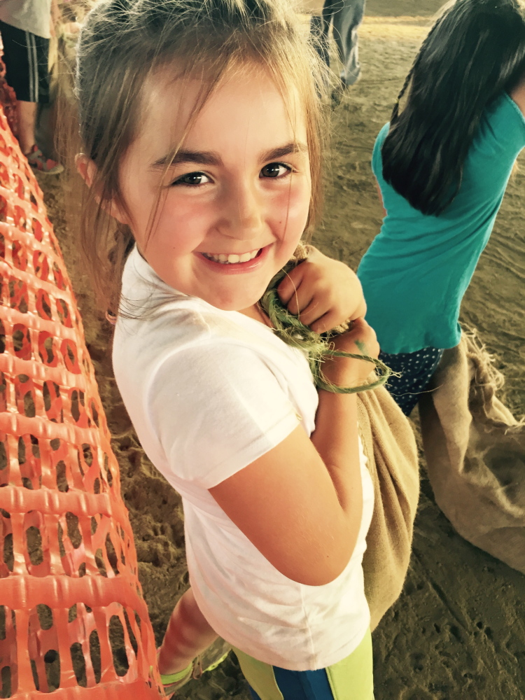 WINDSOR — Brooke Lee, 8, from China, with her new pet pig in the sack in hand, was one of the children selected in the pig scramble Tuesday, Sept. 1, at the Windsor Fair. She was the very first child out of 12 children to catch her pig and put him in the burlap sack. Brooke, daughter of Nichole J. Lee, proudly kept him as her new pet and named him Wilbur.