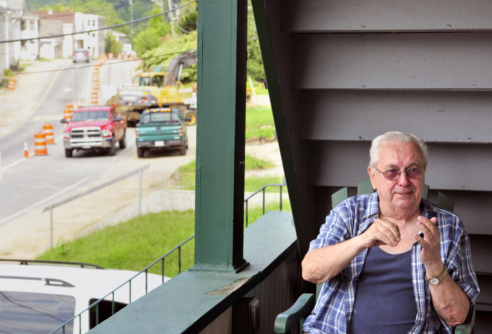 Roger Jean chats with visitors Thursday on the porch of the Mount Vernon Avenue home where he’s lived most of his life as construction continues on Mount Vernon Avenue in Augusta.