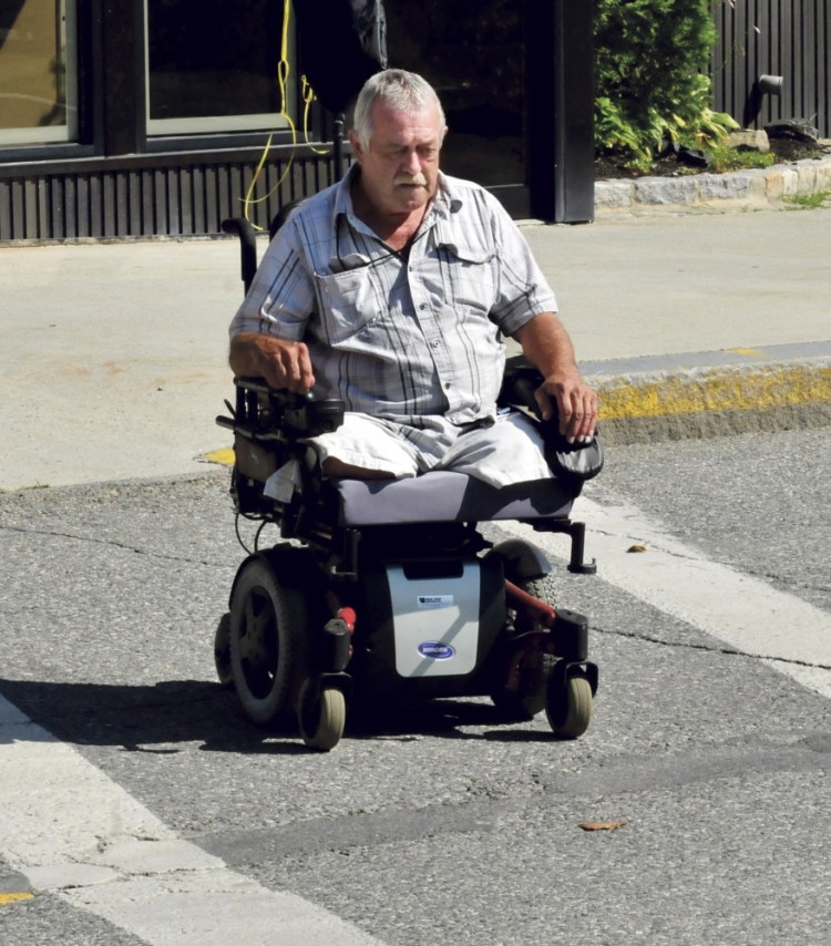 Ray Dudley, who lost both legs to vascular disease, operates his wheelchair in The Concourse in Waterville on Wednesday.