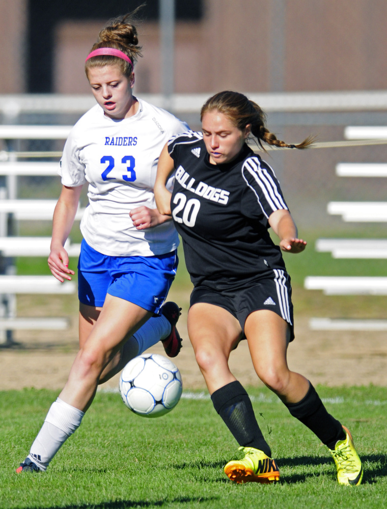 Oak Hill’s Halee Lair (23), left, and Hall-Dale’s Sierra Millay (20) battle for a ball during a game Wednesday in Wales.