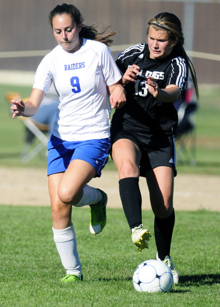 Oak Hill’s Meghan Desjardins (9), left, and Hall-Dale’s Emma Begin (13) battle for ball during a game Wednesday in Wales.