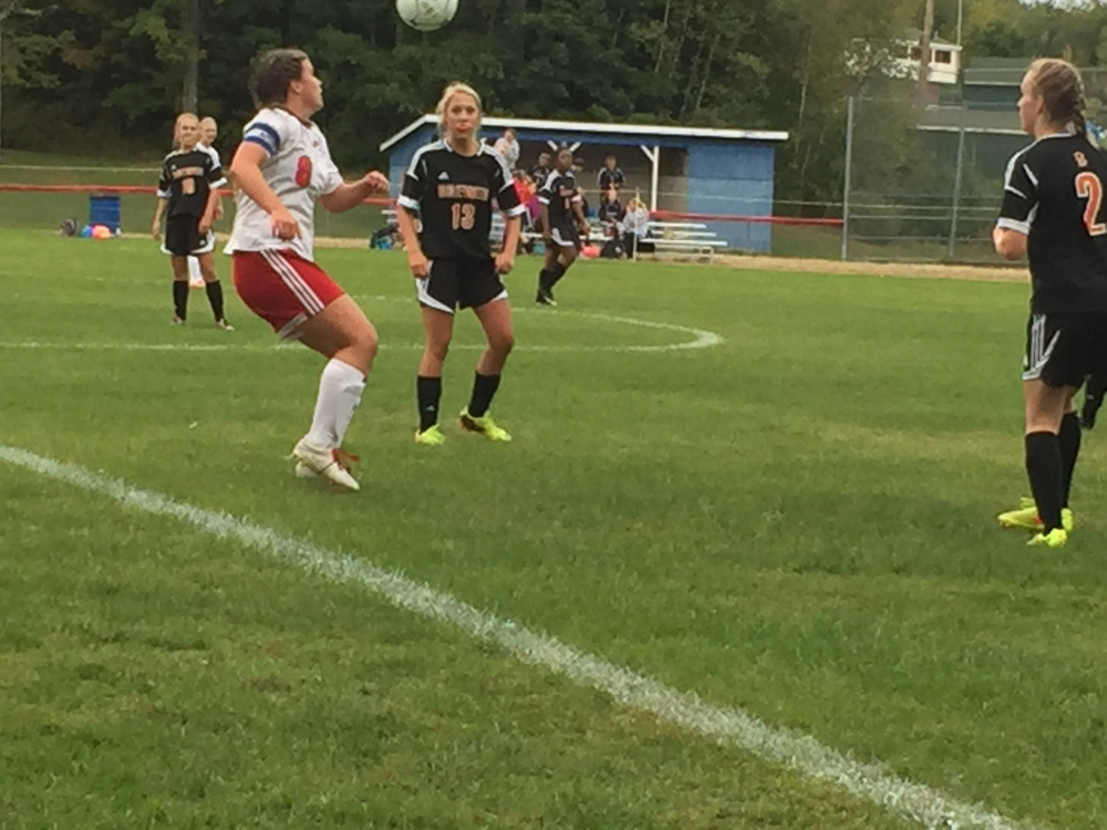 Staff photo by Randy Whitehouse 
 Messalonskee's Katie Guerino, left, looks to control the ball during a game against Brewer on Friday afternoon in Oakland. The Eagles won 3-1.