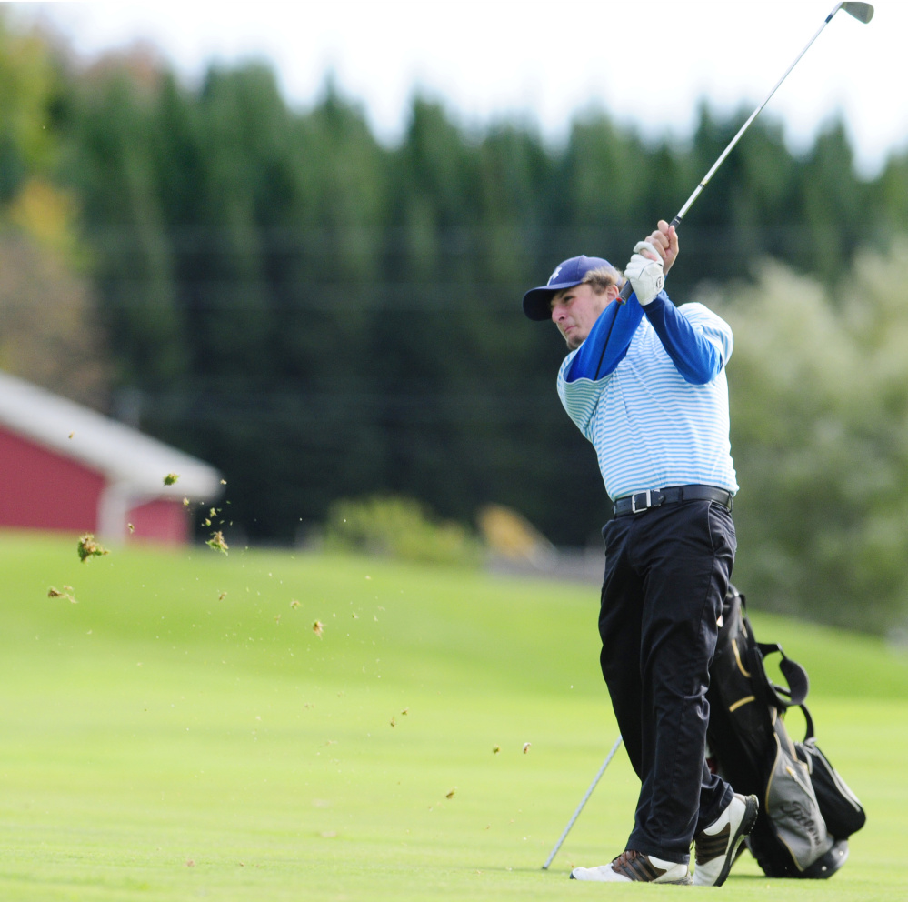 Staff photo by Joe Phelan 
 Messalonskee's Billy Rollins hits a shot from the fairway of the third hole on Natanis' Tomahawk Course during the team state championships last Saturday.