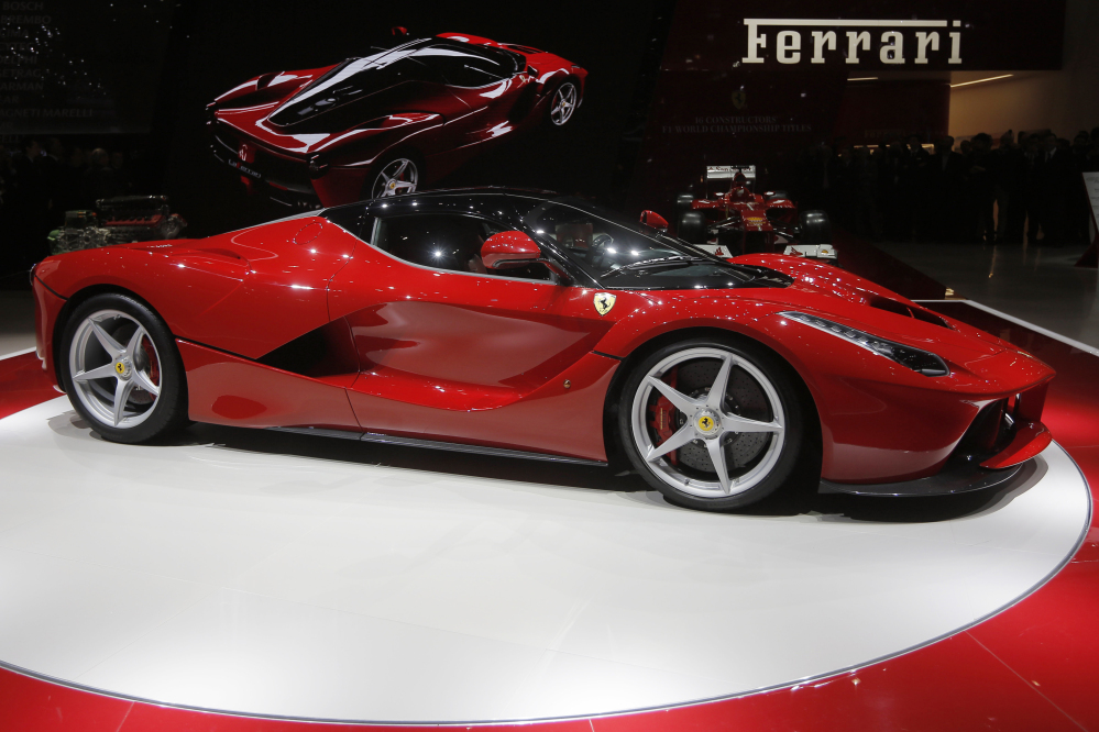 In this March 5, 2013 file photo, the new Ferrari, named LaFerrari, is presented during the first media day of the 83rd Geneva International Motor Show, Switzerland.