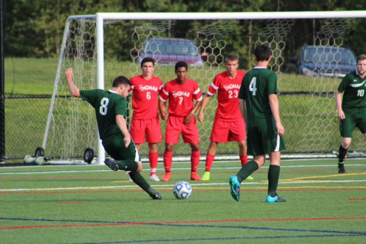 Thomas College’s Josh Emard (6), D.J. Nicholas (7) and Adam LaBrie (23) form a wall in a game played earlier this season in Waterville.