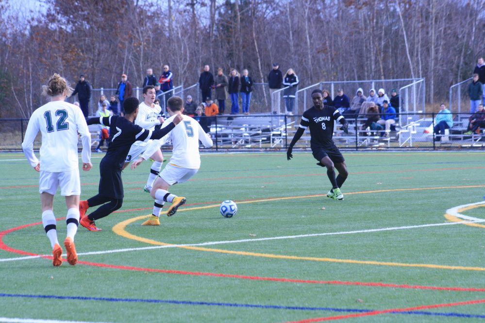 Thomas College’s London Steede-Jackson (8) pursues the ball as teammate D.J. Nicholas (7) looks on in a game played in Waterville earlier this season.