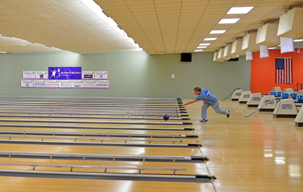 Rick Gilbert rolls one of the last frames Sparetime Recreation on West River Road in Waterville in April. The building has been renovated to house Centerpoint Community Church, which holds its first service in its new building Sunday.