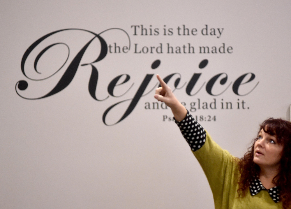 Lisa Riportella, events and outreach coordinator for Centerpoint Community Church, puts the finishing touches on the newly renovated church at the former Sparetime Recreation building on West River Road in Waterville.