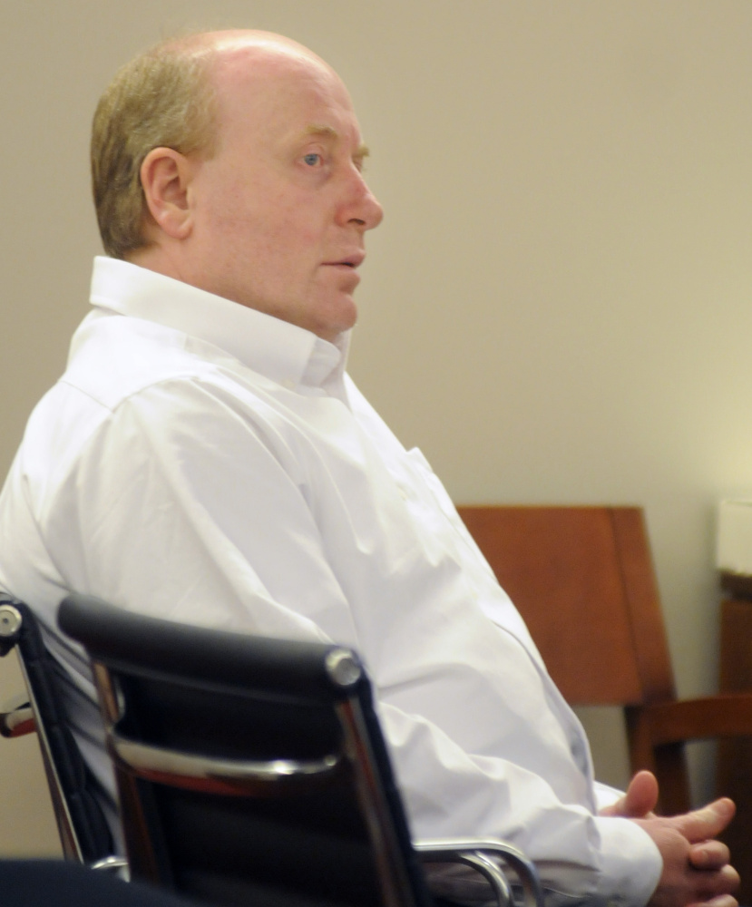 Roland L. Cummings listens Wednesday to state prosecutors summarize their case against him in the murder of 92-year-old Aurele Fecteau during a trial in Augusta.