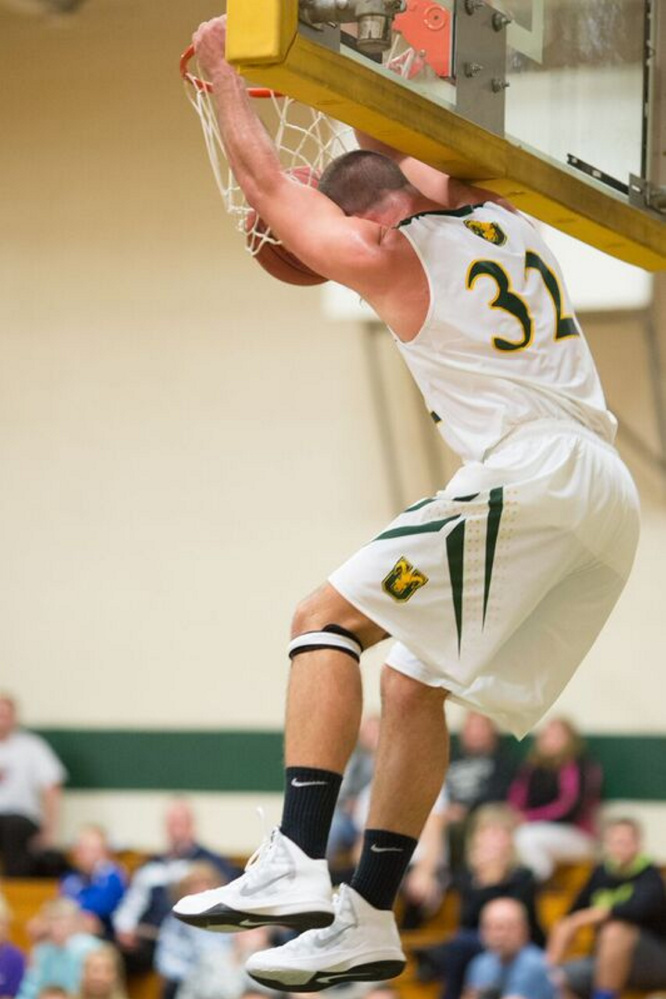 Unity senior guard Peter Kopacz dunks during a Nov. 3 game against Central Maine Community College. Kopacz is one of the top players in the Yankee Small College Conference.