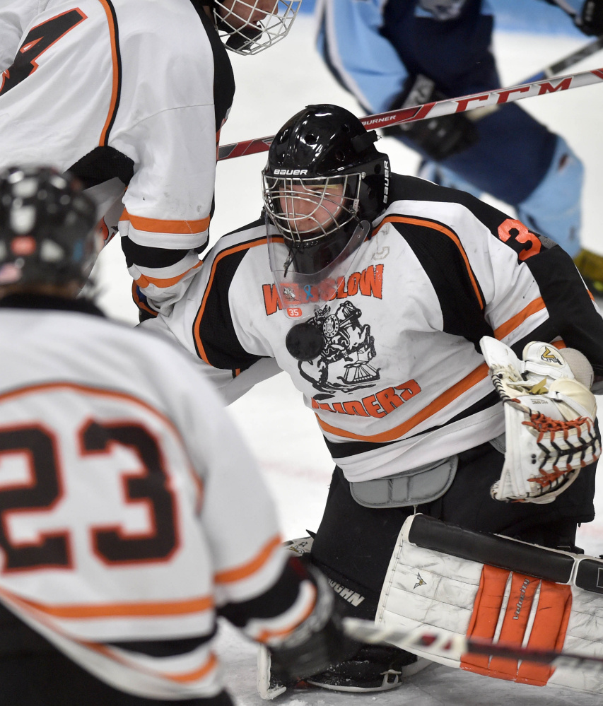 Winslow goalie Andrew Beals makes a save during a Class B North game against Old Town/Orono on Saturday night at Sukee Arena. Beals finished with 17 saves in a 3-1 victory.