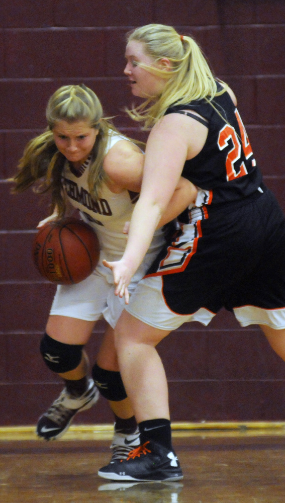 Richmond High School’s Kelsea Anair dribbles around North Yarmouth Academy’s Sydney Plummer on Wednesday in Richmond.