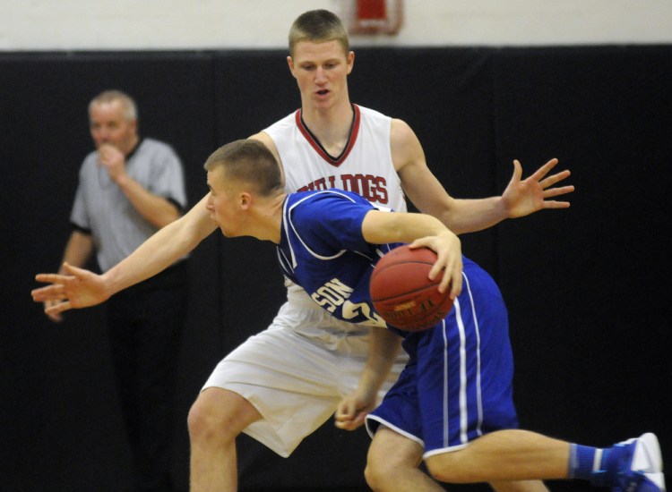 Hall-Dale High School's Josh Berberich, back, blocks Madison Area Memorial High School's Devon Watt on Monday in Farmingdale.