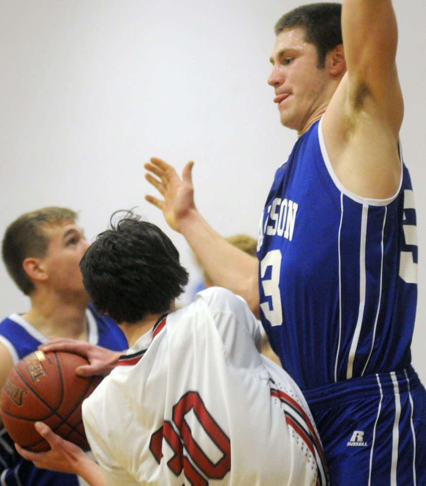 Hall-Dale High School's Hall-Dale's Owen Dupont, left, is blocked by Madison Area Memorial High School's Mitch Jarvais on Monday in Farmingdale.