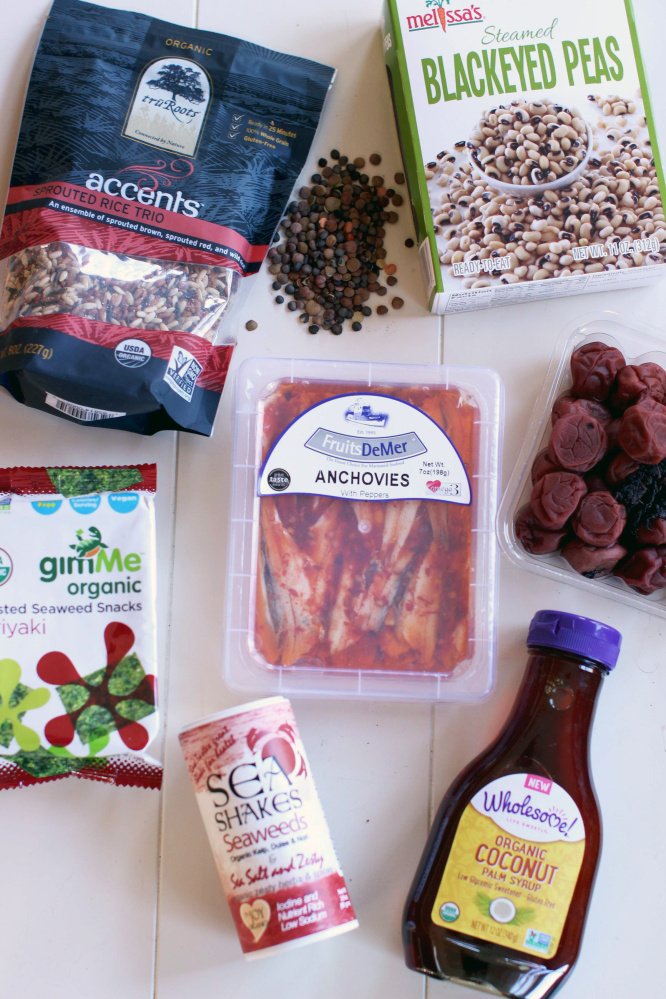 From top left, sprouted rice and beans and prepared legumes; middle, seaweed snacks, anchovies and pickled umeboshi; bottom, seaweed seasonings and coconut syrup.