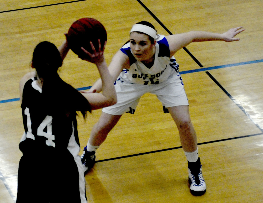 Madison’s Lauren Hay, back, pressures Carrabec’s Mel Clark during a Mountain Valley Conference game Monday night in Madison.