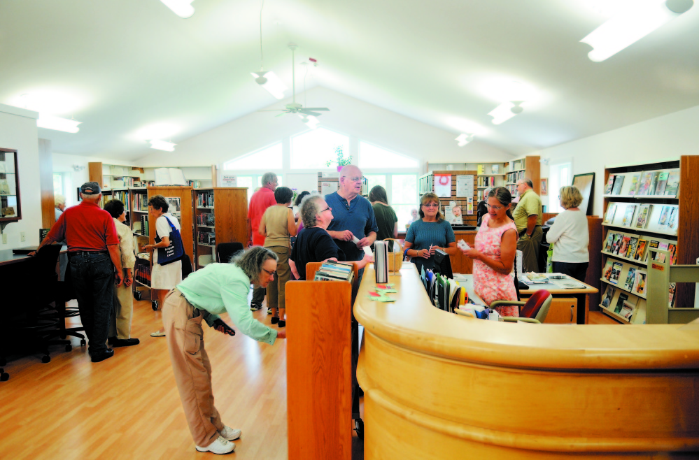 Patrons crowd the Belgrade Public Library in 2013 during the official opening ceremony.