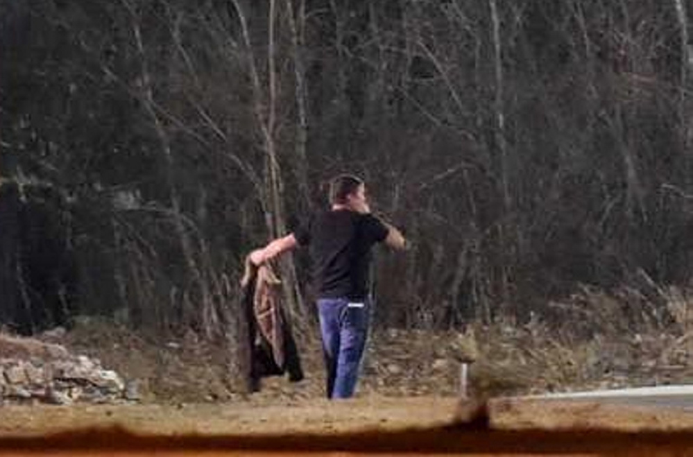 Gary Cross surrenders to police in the early morning of Dec. 8 after an eight-hour standoff with police in Waterville.