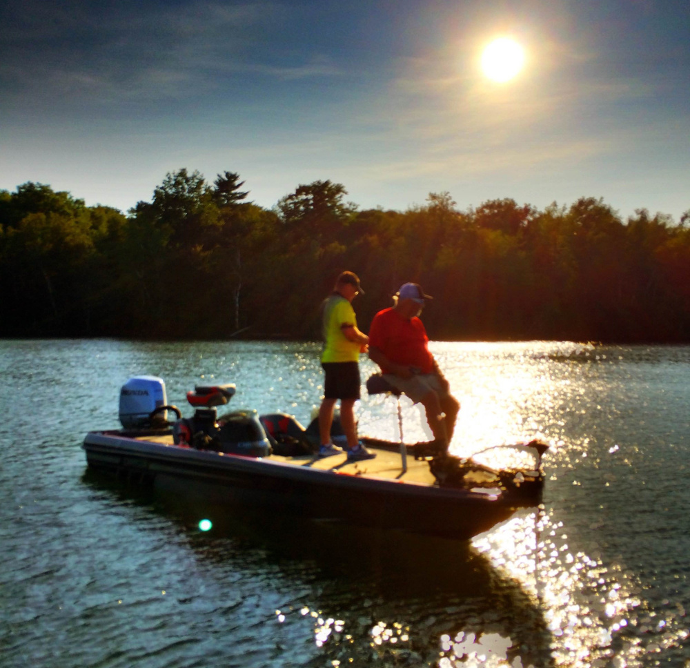 Ted Thibault of fishing equipment firm Tuf-Line and Charlie Ingram of the Outdoor Channel show “Fishing University” cast their lines in China Lake during a September sunset during an episode taping of the show. The episode airs this weekend.