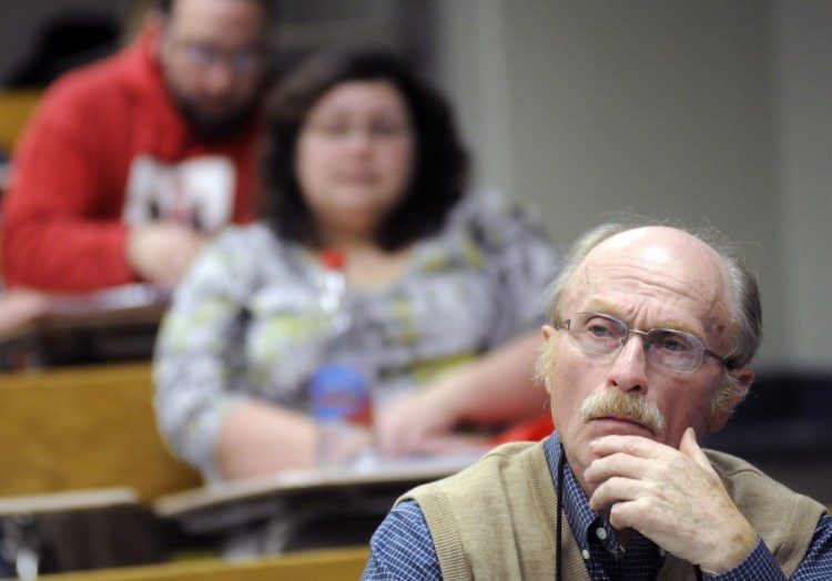 George Van Deventer, 80, listens to a lecture last week during a U.S. History II class at the University of Maine at Augusta.