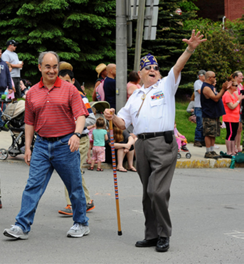 Rep. Bruce Poliquin walks alongside Norman Rossignol, a decorated Army veteran from Bangor who will be Poliquin’s guest at the State of the Union address Tuesday. 