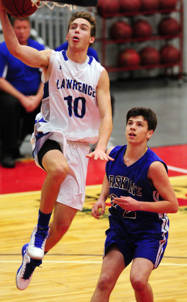 Lawrence’s Mason Cooper goes for a layup during a game against Erskine at the Capital City Hoops Classic in Augusta earlier this season. Cooper and the Bulldogs will play Medomak Valley in a Class A North quarterfinal Saturday.